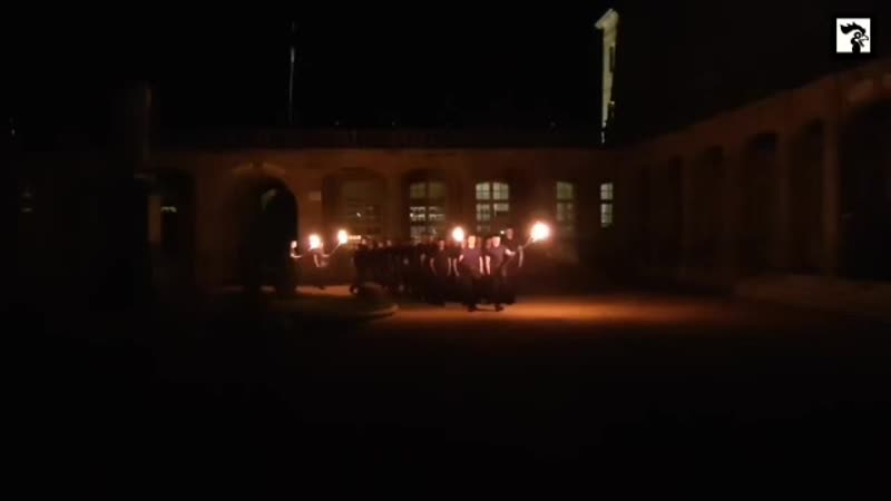 Young French patriots gathered with torchlights to sing a traditional song paying tribute to the