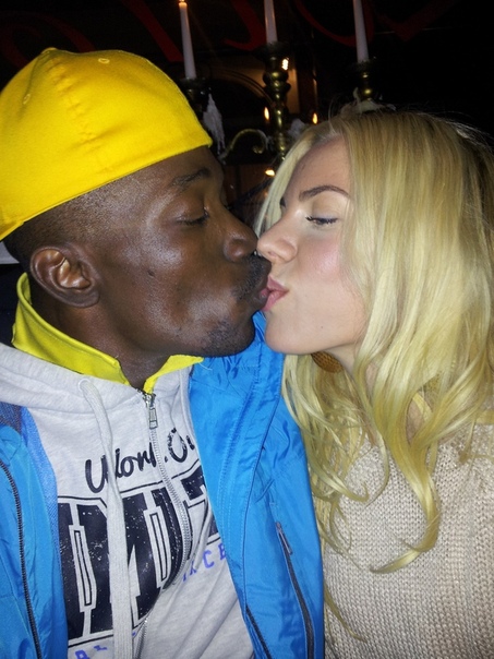 Black girl and asian guy kissing